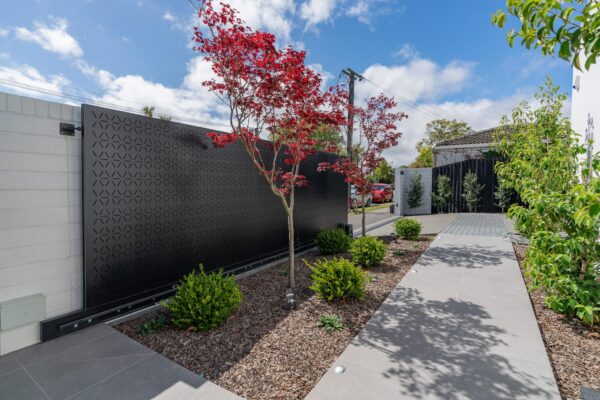 custom black metal electric privacy gate designed and installed at a private property by Axiom Built in Christchurch