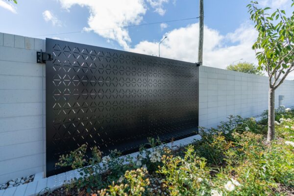 custom black aluminium architectural fence panel designed and installed for garden decoration by Axiom Built in Christchurch