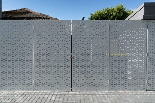 custom light grey aluminium architectural fence panels and security gate designed and installed by Axiom Built in Christchurch, Canterbury